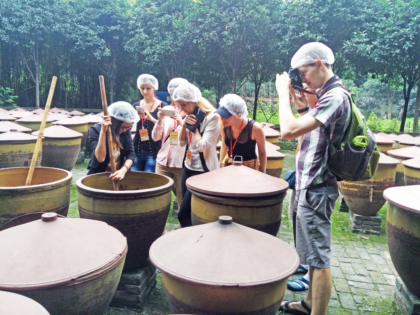 people stirring pots at Chengdu Sichuan Cuisine Museum