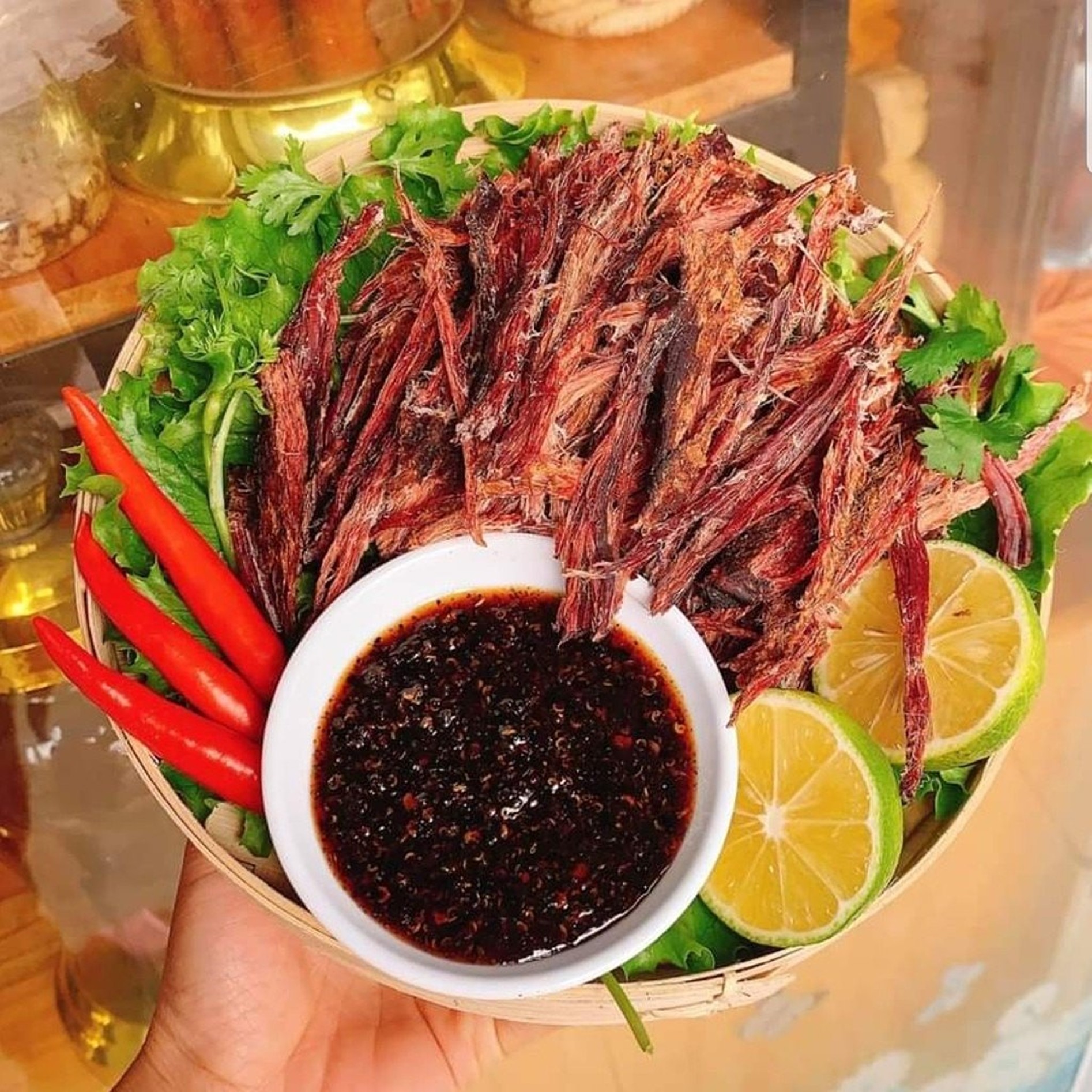 Visit a local home where you’ll sample Thịt Trâu Gác Bếp, smoked buffalo meat seasoned with traditional spices and a sip of Rượu Hmong, a traditional rice wine