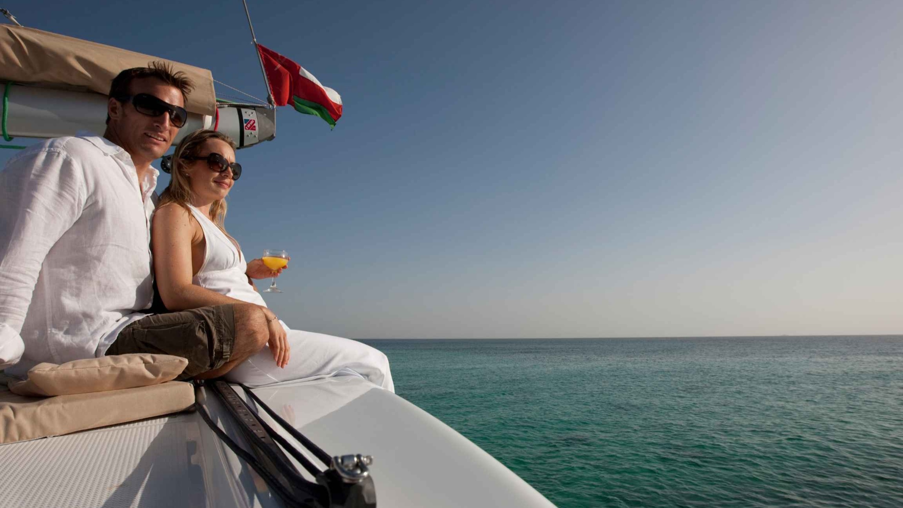 Marvel at vibrant coral gardens teeming with colorful marine life beneath the waves