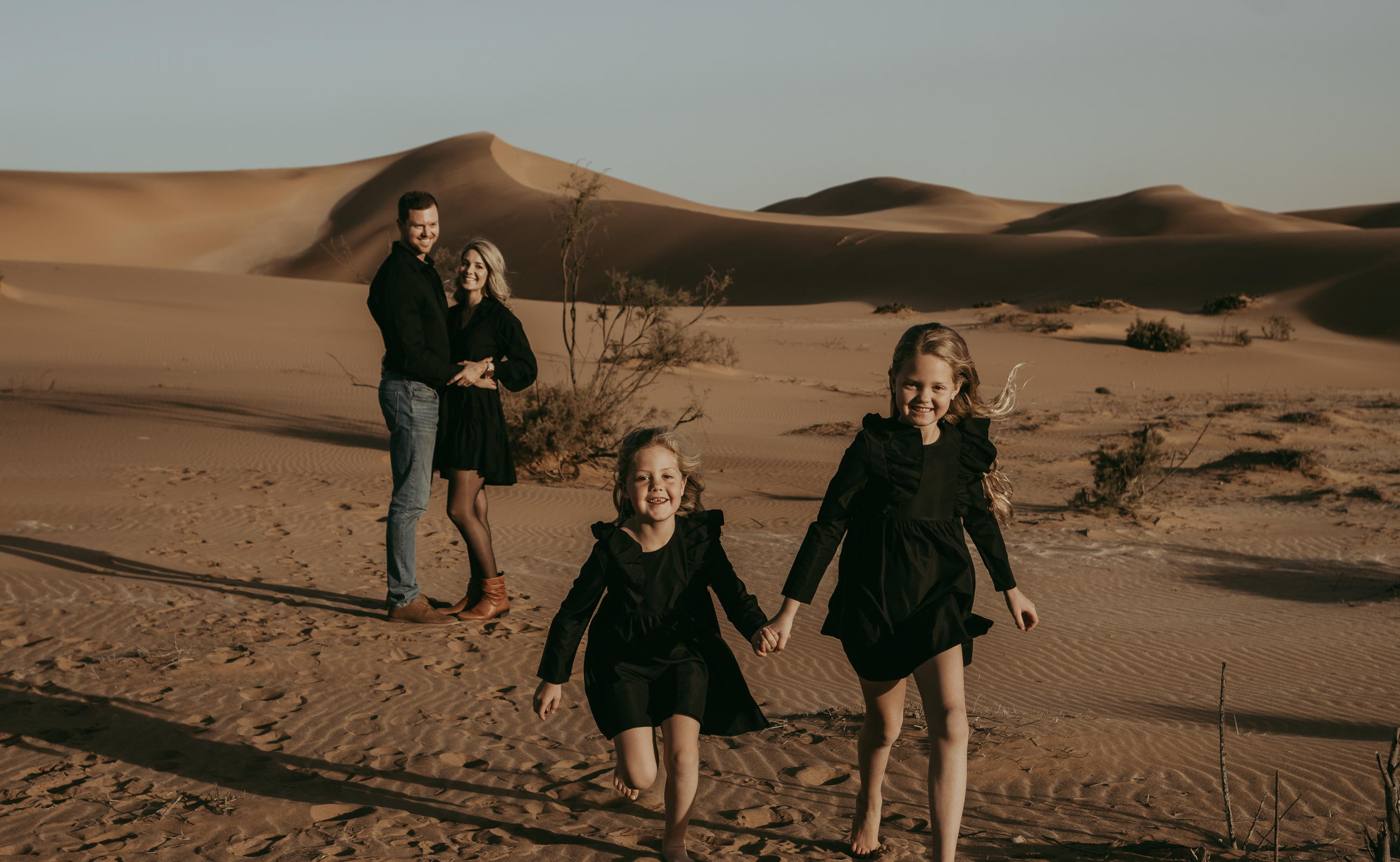 Family having fun in the dunes.