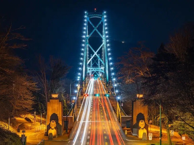 Enjoy panoramic nighttime views of Lions Gate Bridge from the scenic Stanley Park Seawall
