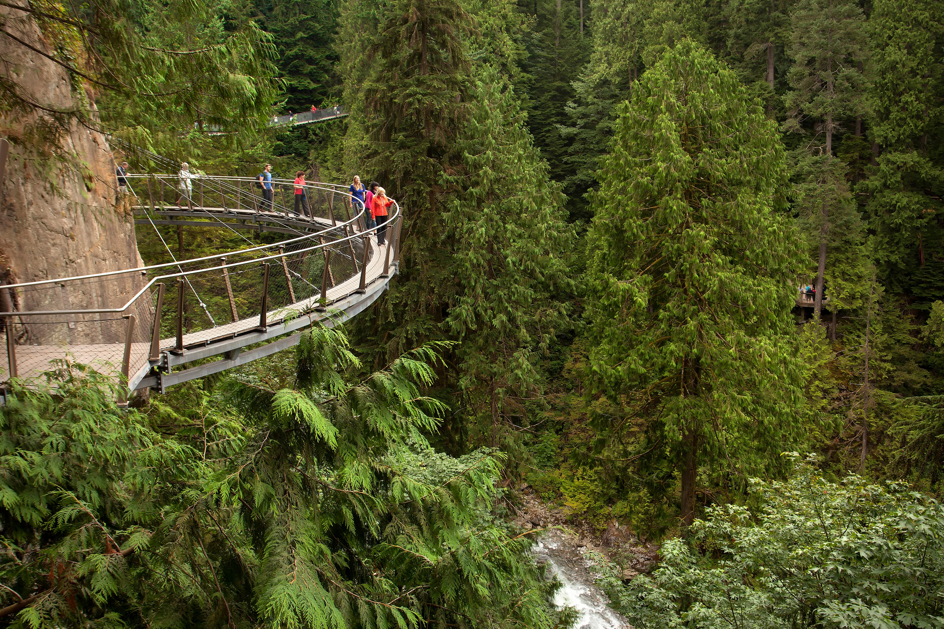 Thrill in crossing a suspension bridge amid ancient pines and dare the exhilarating Cliff Walk