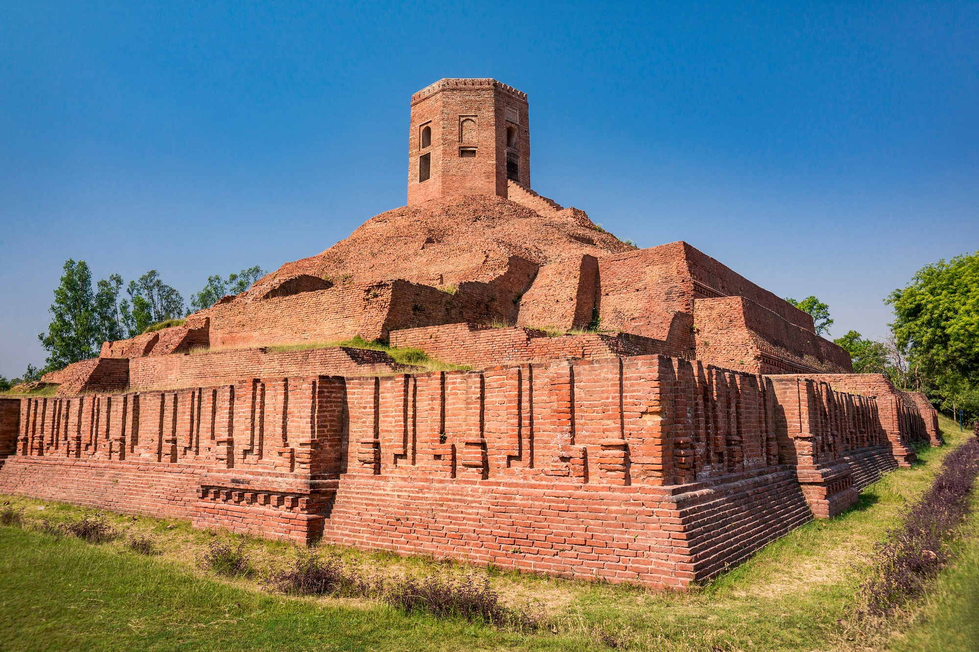 Ruins of ancient Chaukhandi Buddhist Stupa with brick work exterior view at holy pilgrimage site, Sarnath.