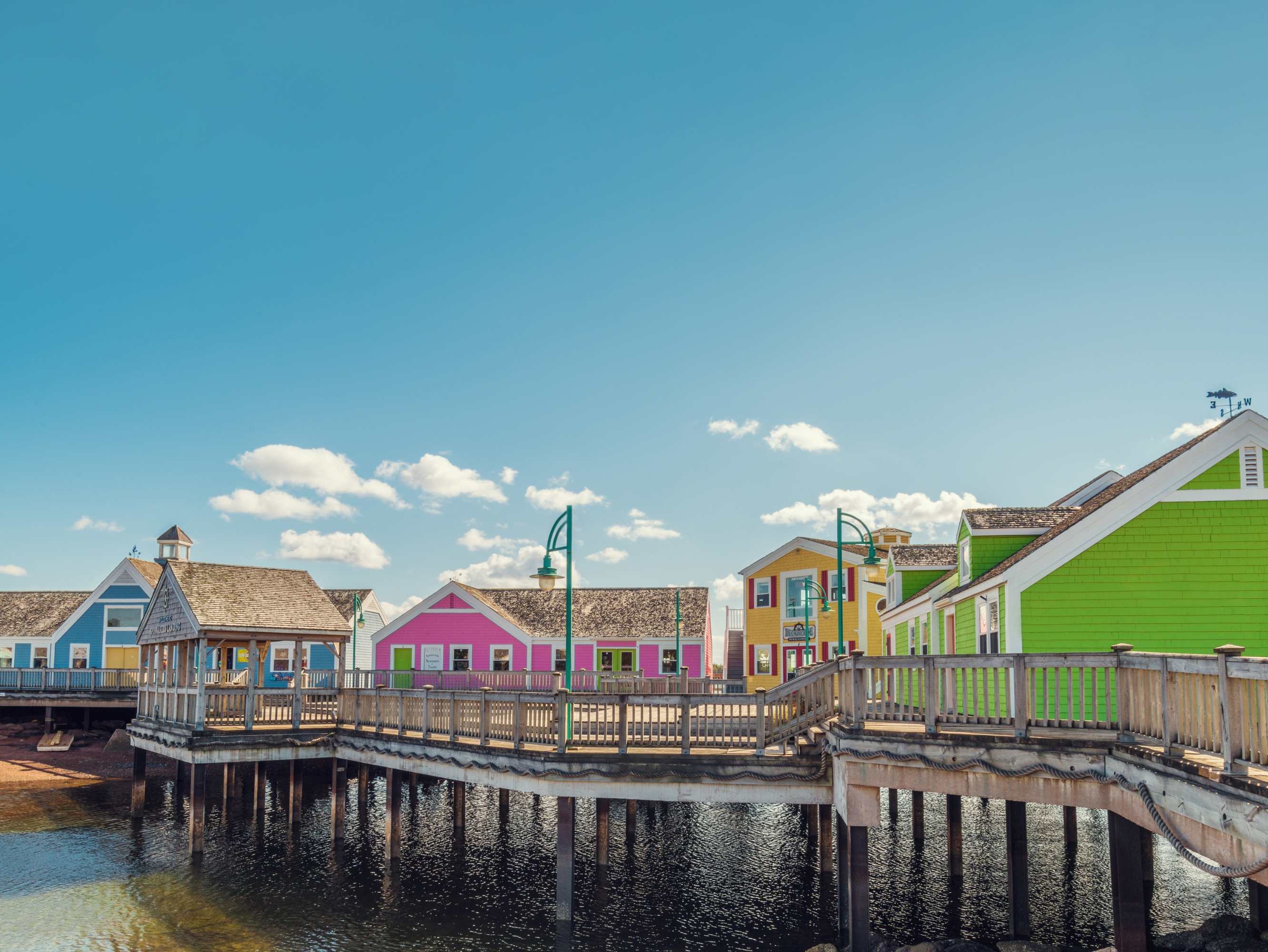 Wander through PEI’s vibrant coastal villages, where colorful seaside shops and stunning boardwalk views await.