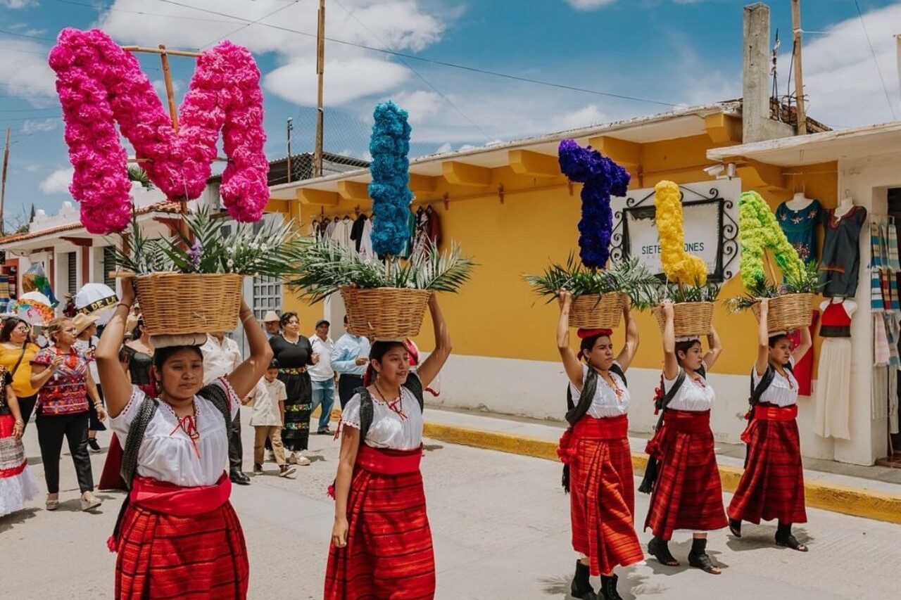 Woman in Teotitlán wearing traditional attire, showcasing handcrafted textiles