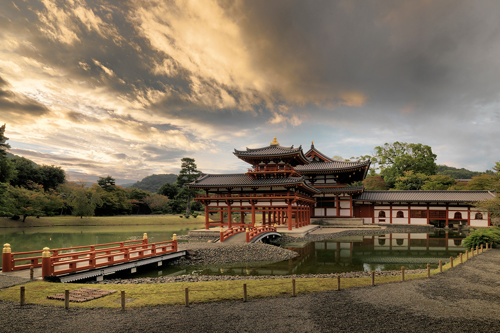Vermillion corridors and stone lanterns stand side-by-side, showcasing the charm of a thousand-year-old shrine.