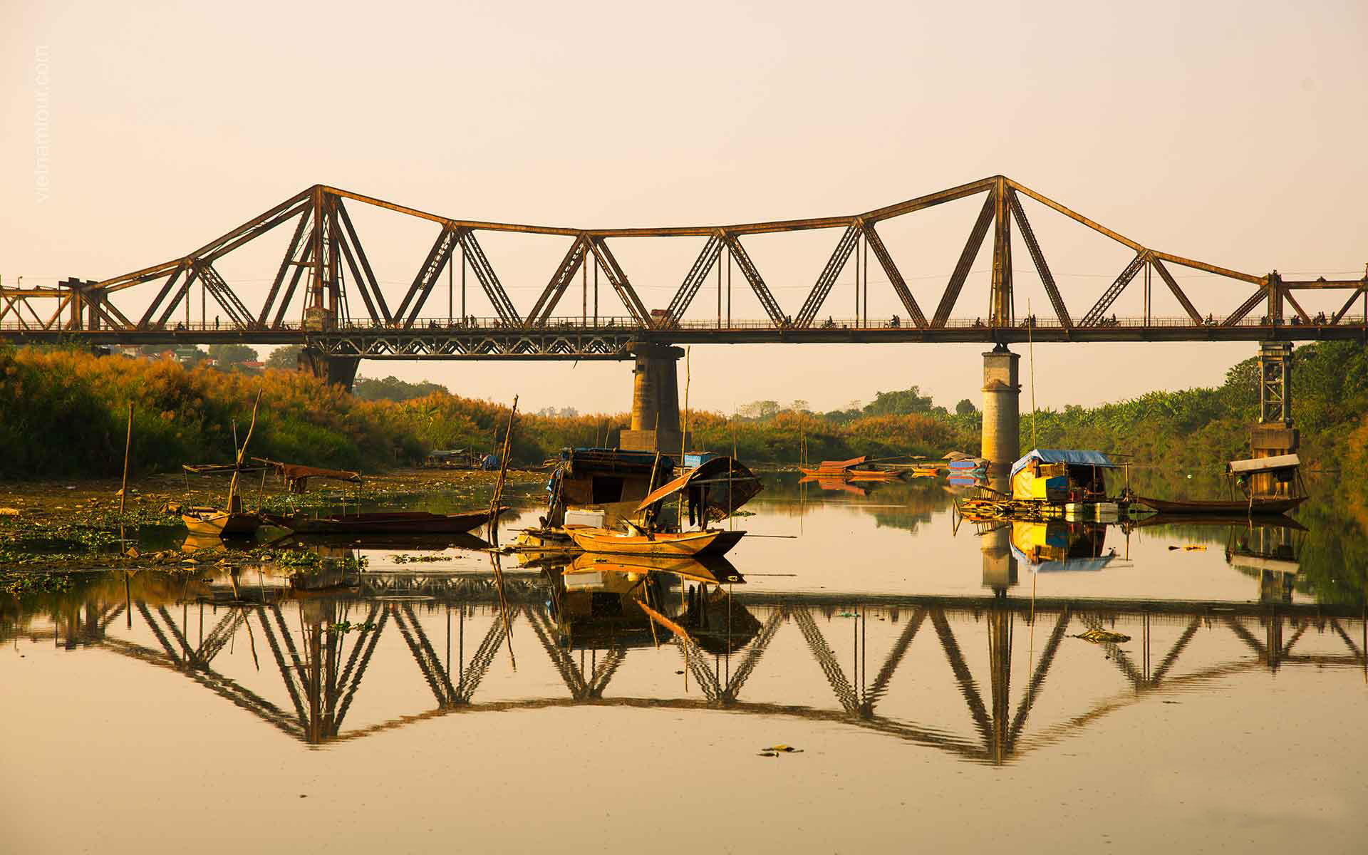 Long Bien Bridge is one of the most famous bridges in Hanoi. It has experienced so much devastation, yet, it is still standing over the Red River as a precious symbol representing the painful history of Hanoi.