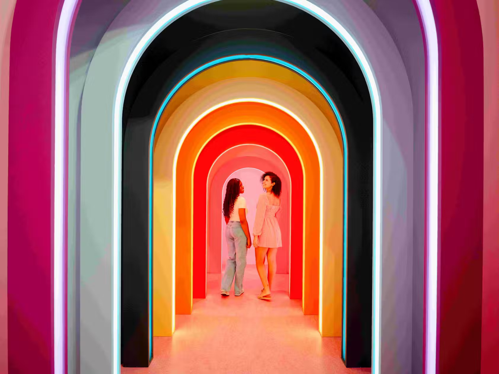 Walk joyfully beneath the rainbow arch surrounded by color, flavor, and imagination