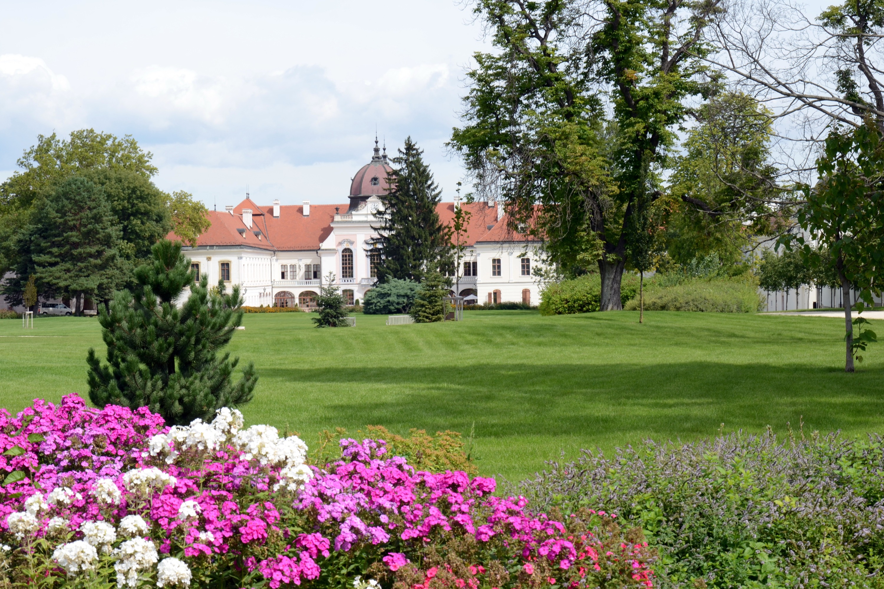 Godollo Palace from afar with colorful flowers