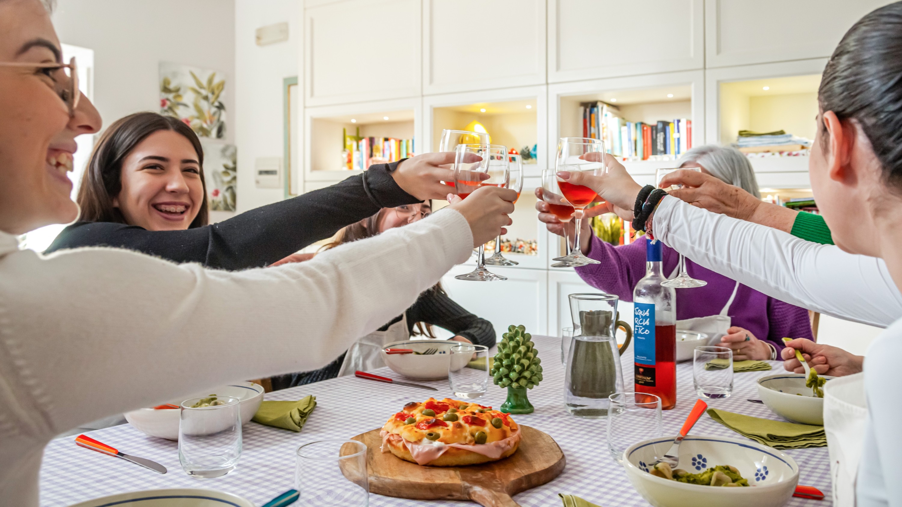 A joyful gathering, savoring homemade dishes with fine wine and warm conversation