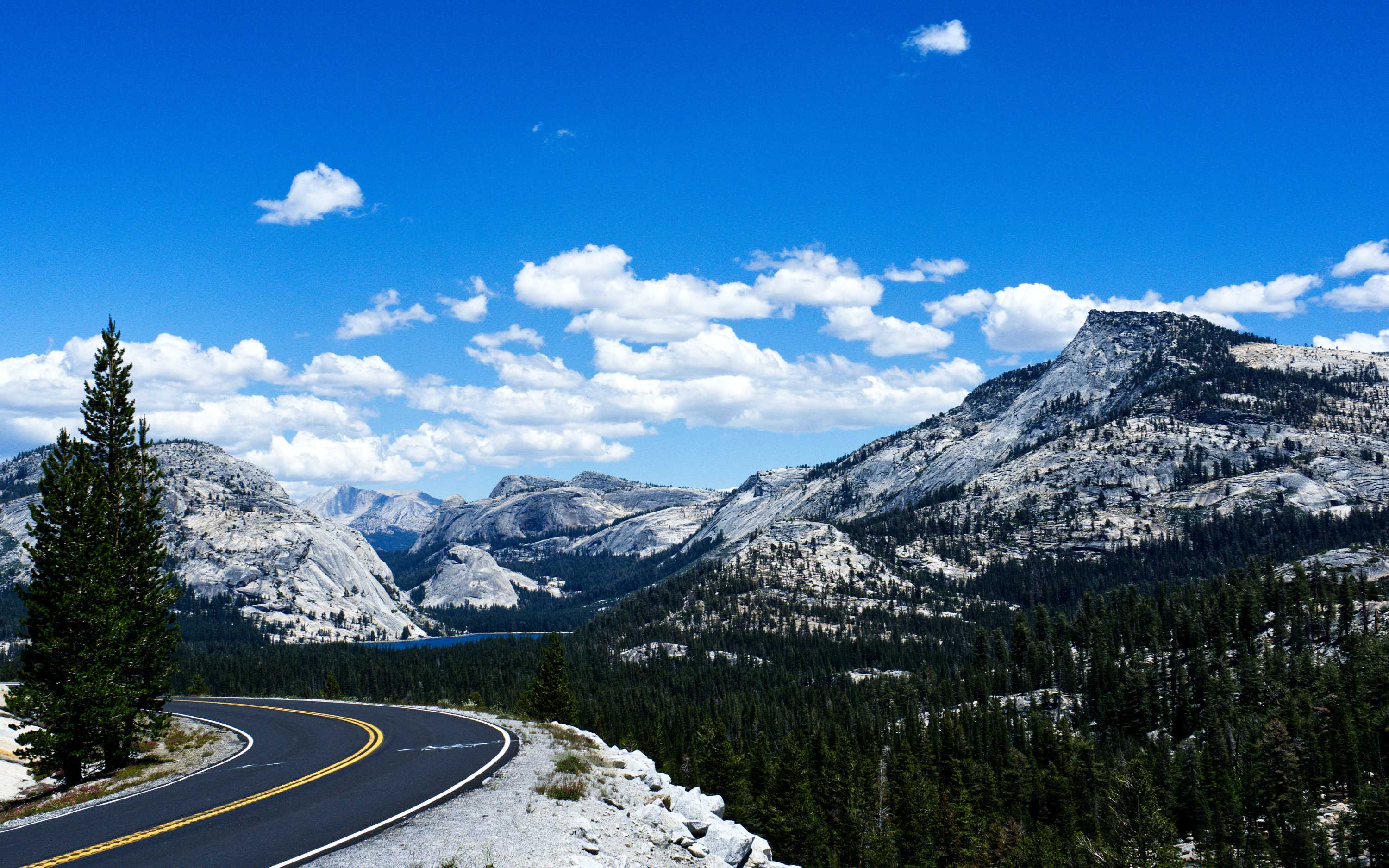 Dramatic granite peaks along Tioga Pass reach high into the Sierra sky Dramatic granite peaks along Tioga Pass reach high into the Sierra sky