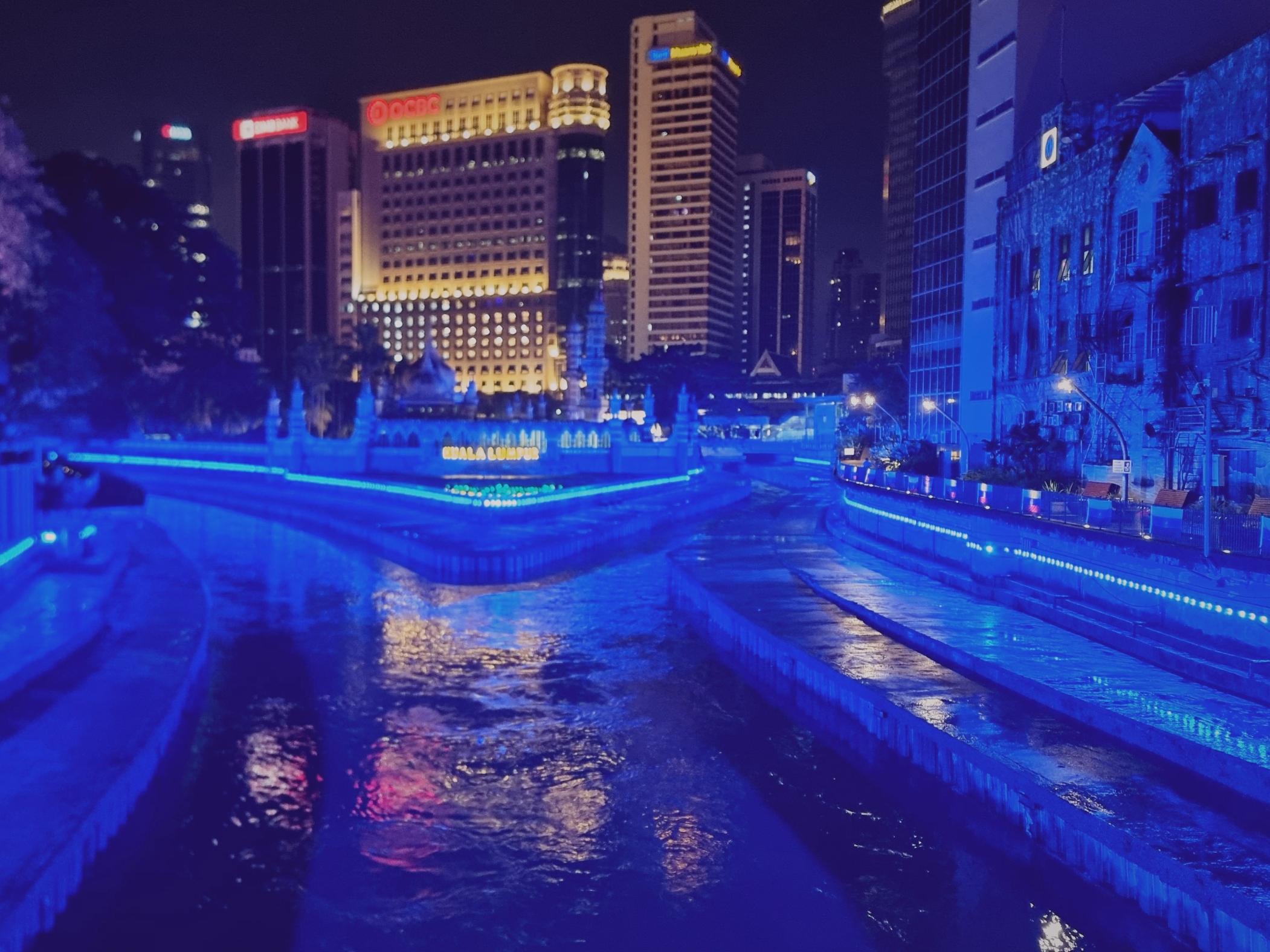 River of Life, where vibrant lights illuminate scenic waterfront views