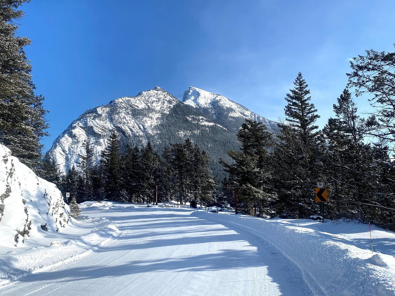 Stroll snowy streets and explore Banff’s charming winter wonderland beneath towering peaks