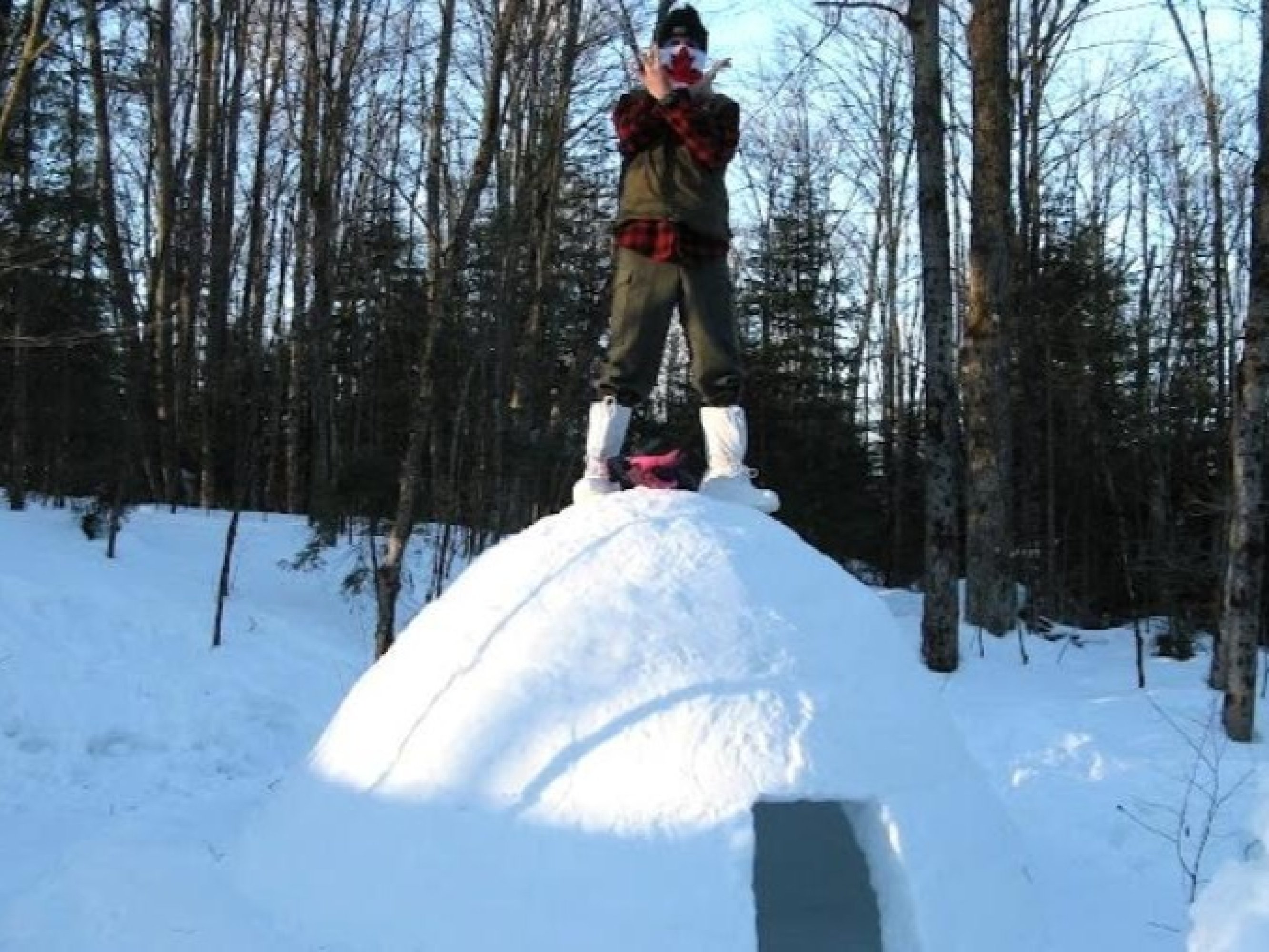 Celebrate the first entry into the igloo—a warm glow contrasting the crisp Ontario forest air