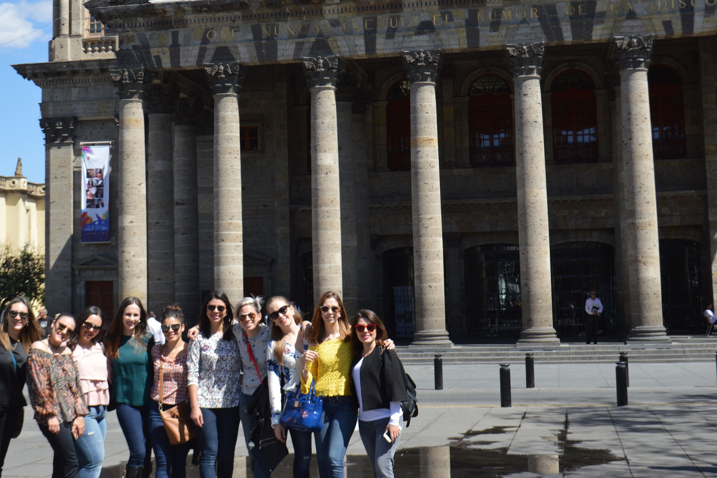 Tourists marveling at the intricate architecture of Guadalajara’s historic buildings