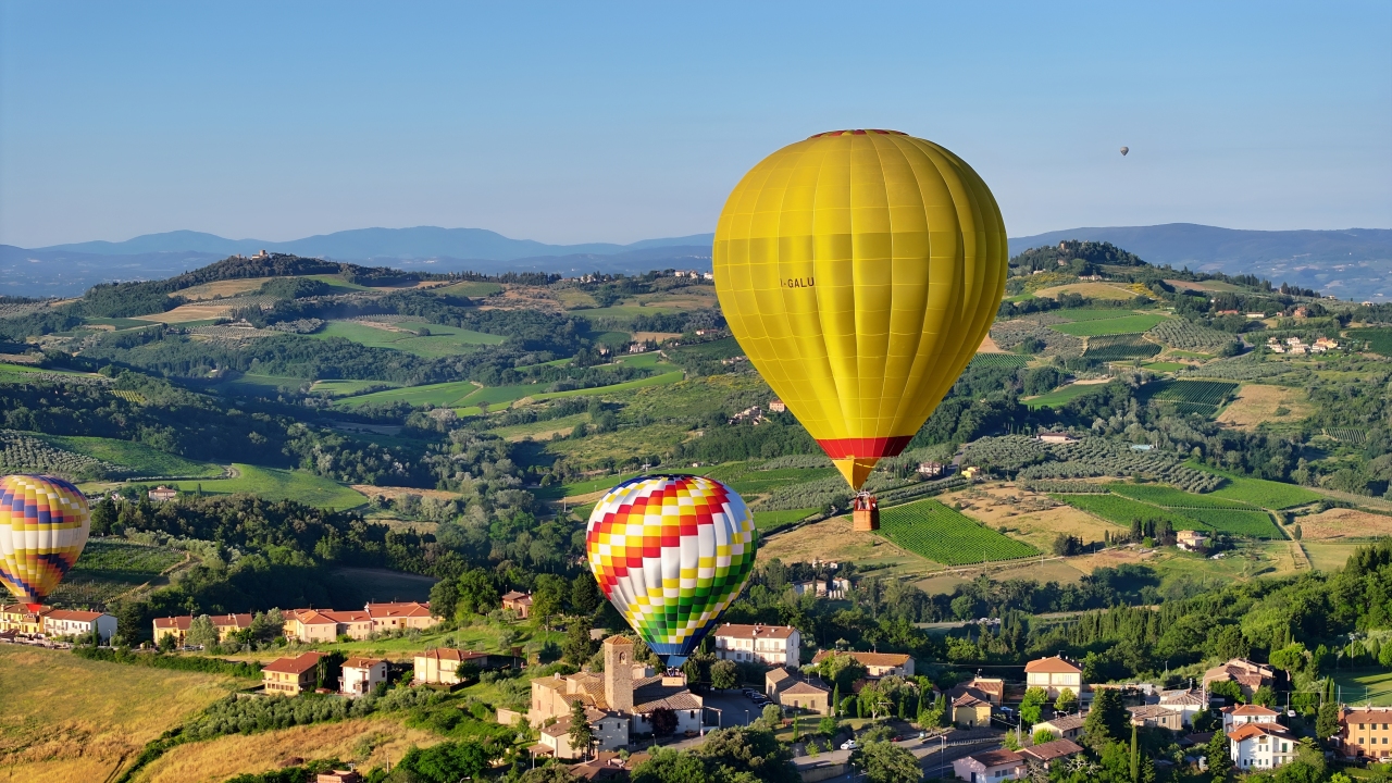 Drift serenely through the sky and take in the stunning views of San Gimignano