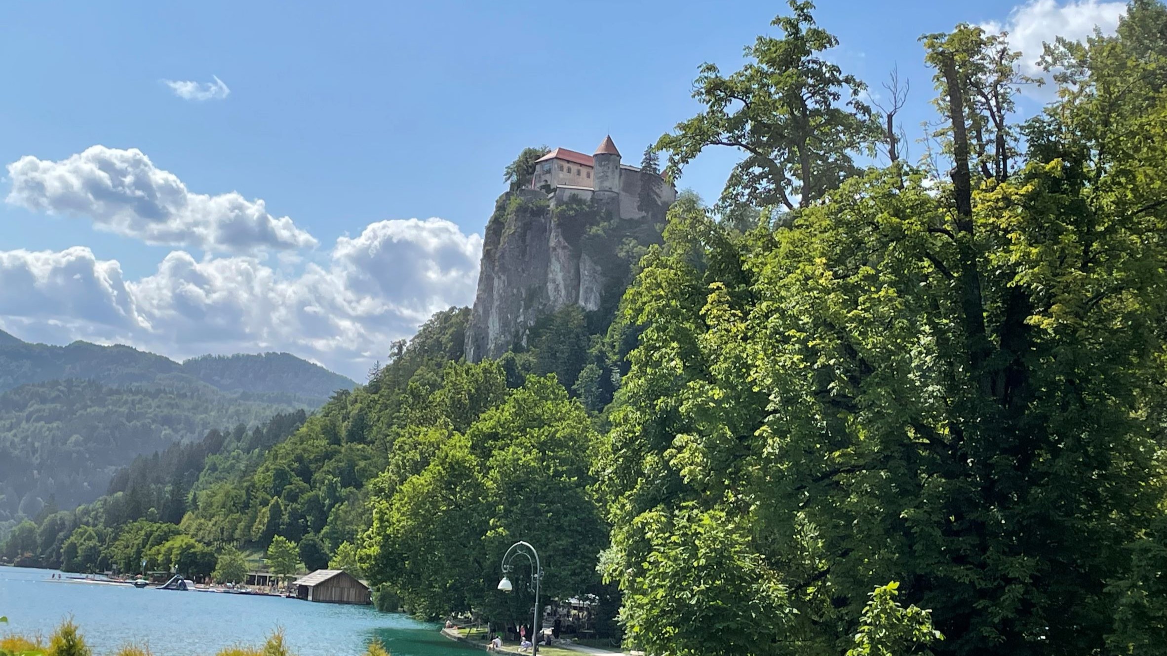 Majestic granite cliffs towering above a serene riverside landscape