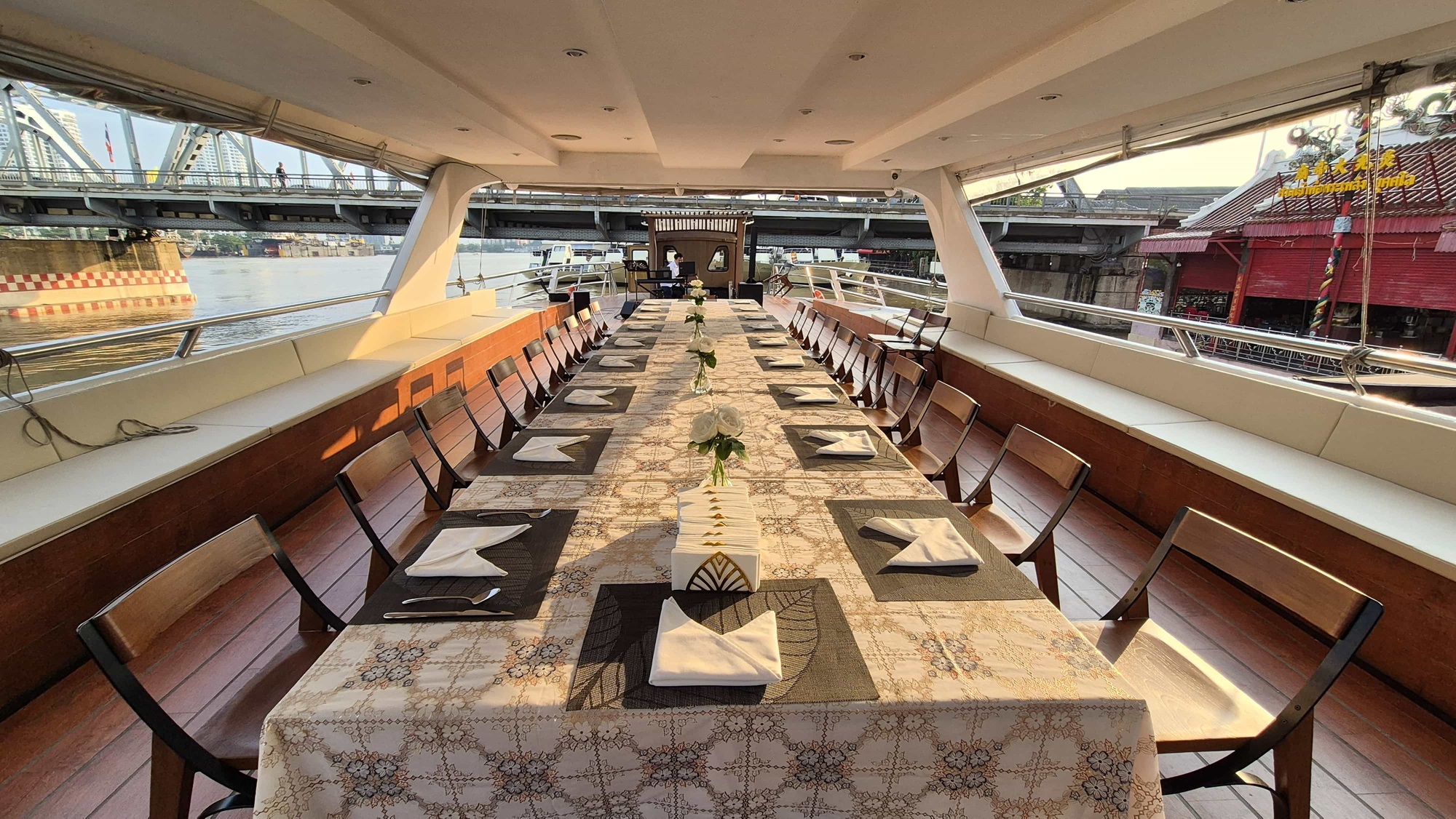 "Elegant dining with panoramic river views."