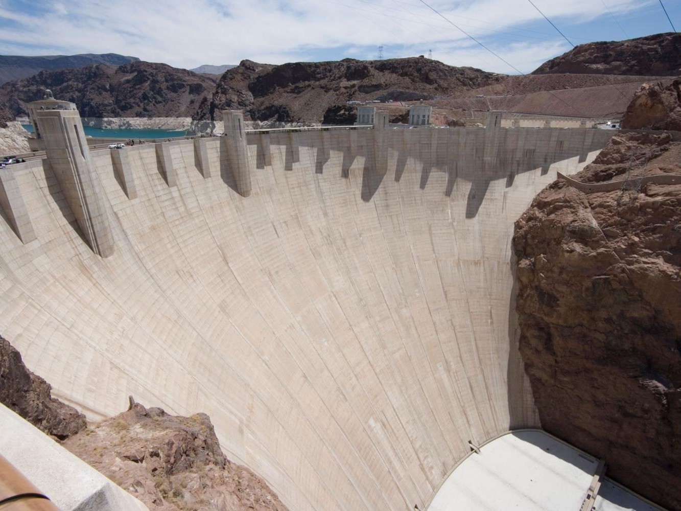 Admire the dam’s massive concrete face holding back Lake Mead’s shimmering waters gracefully