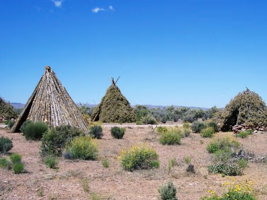 Guests marveling at Eagle Point’s ancient Native American dwellings and cultural village exhibits