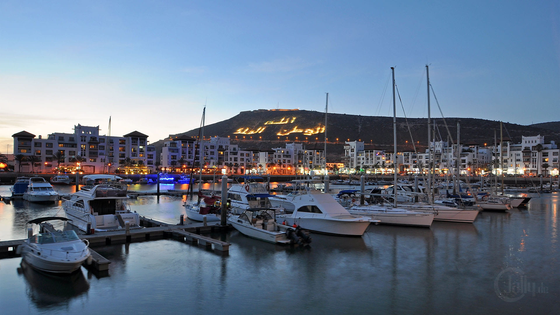 Relax at Agadir Marina with stunning evening views!