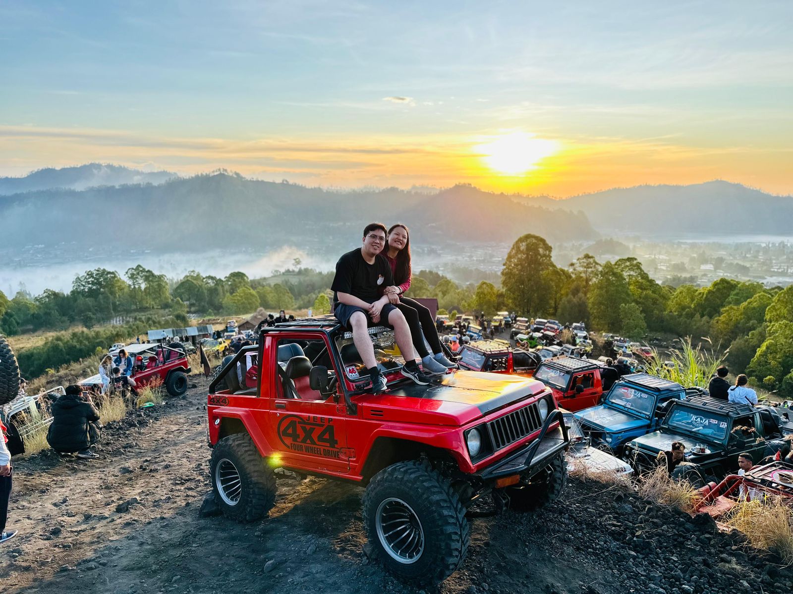 Take a good photo on a jeep with a magical and amazing view on Mount Batur at sunrise