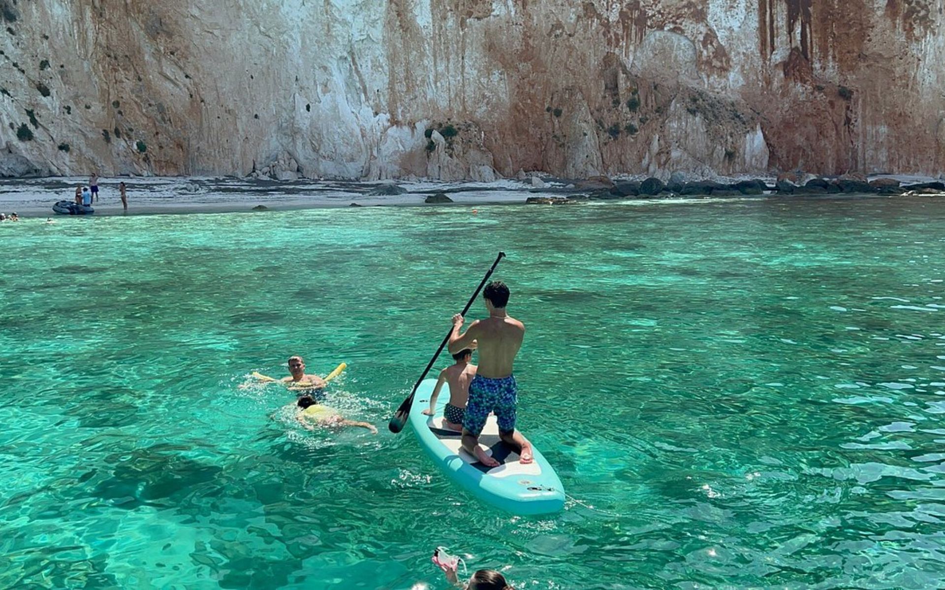 Dive into the crystal-clear turquoise waters and embrace the serenity of this secluded haven