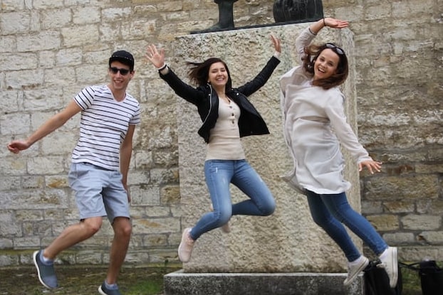 Three friends posing for a jump shot