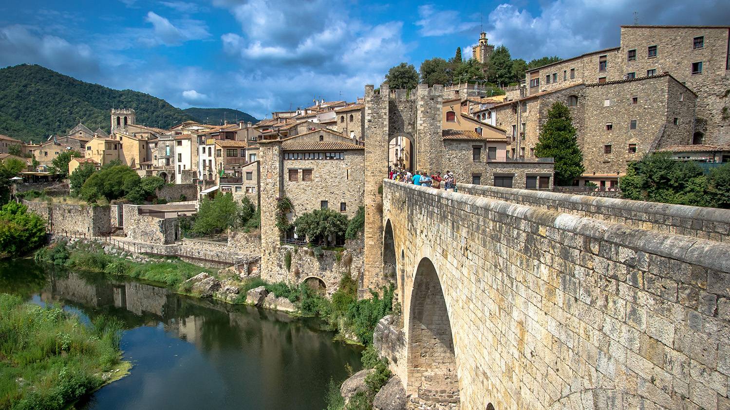 Sunlight filters through the archways of Besalu’s ancient streets, creating a magical ambiance