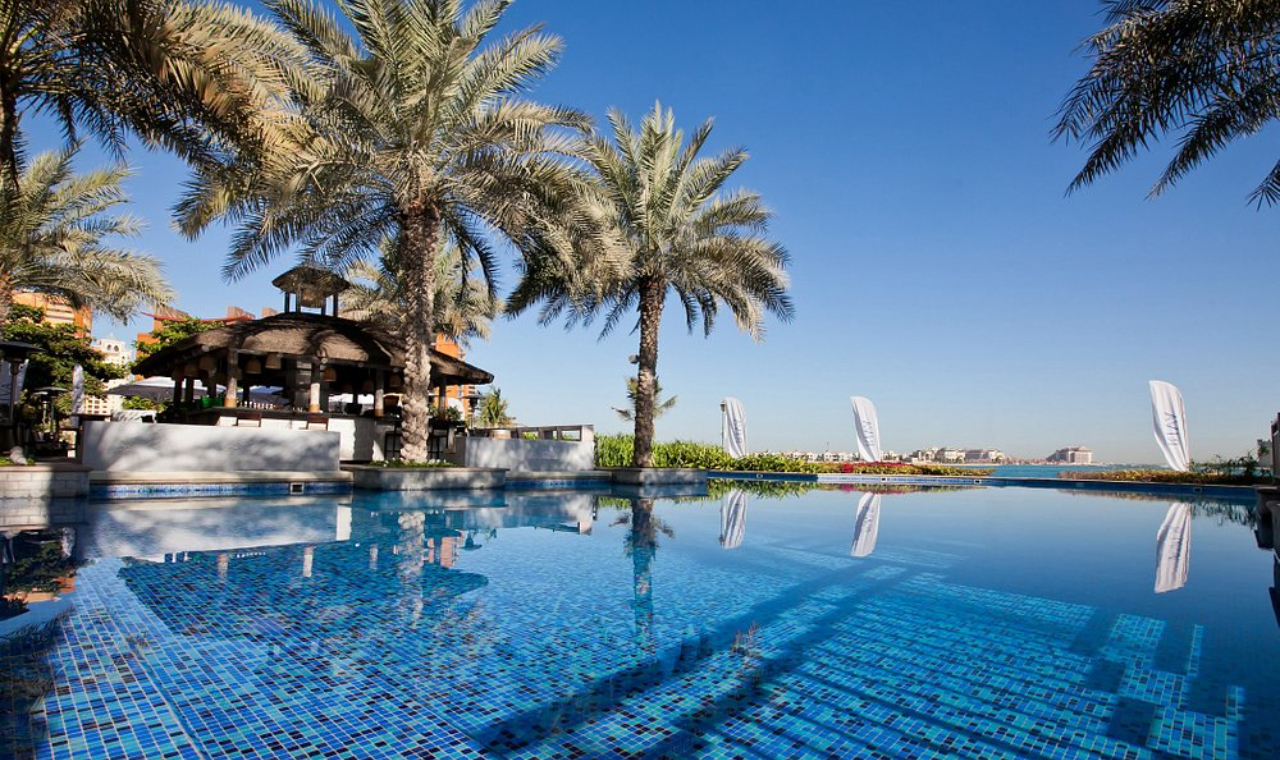 Relax by the poolside and soak up the serene coastal atmosphere