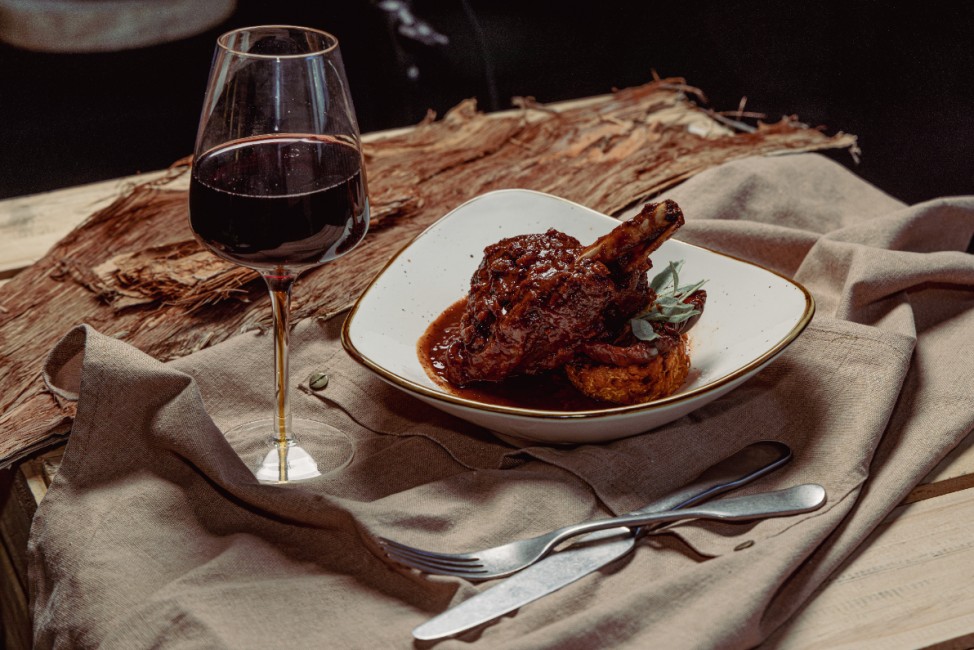 Dine at Midden restaurant, offering harbour views and Indigenous-inspired dishes with flair
