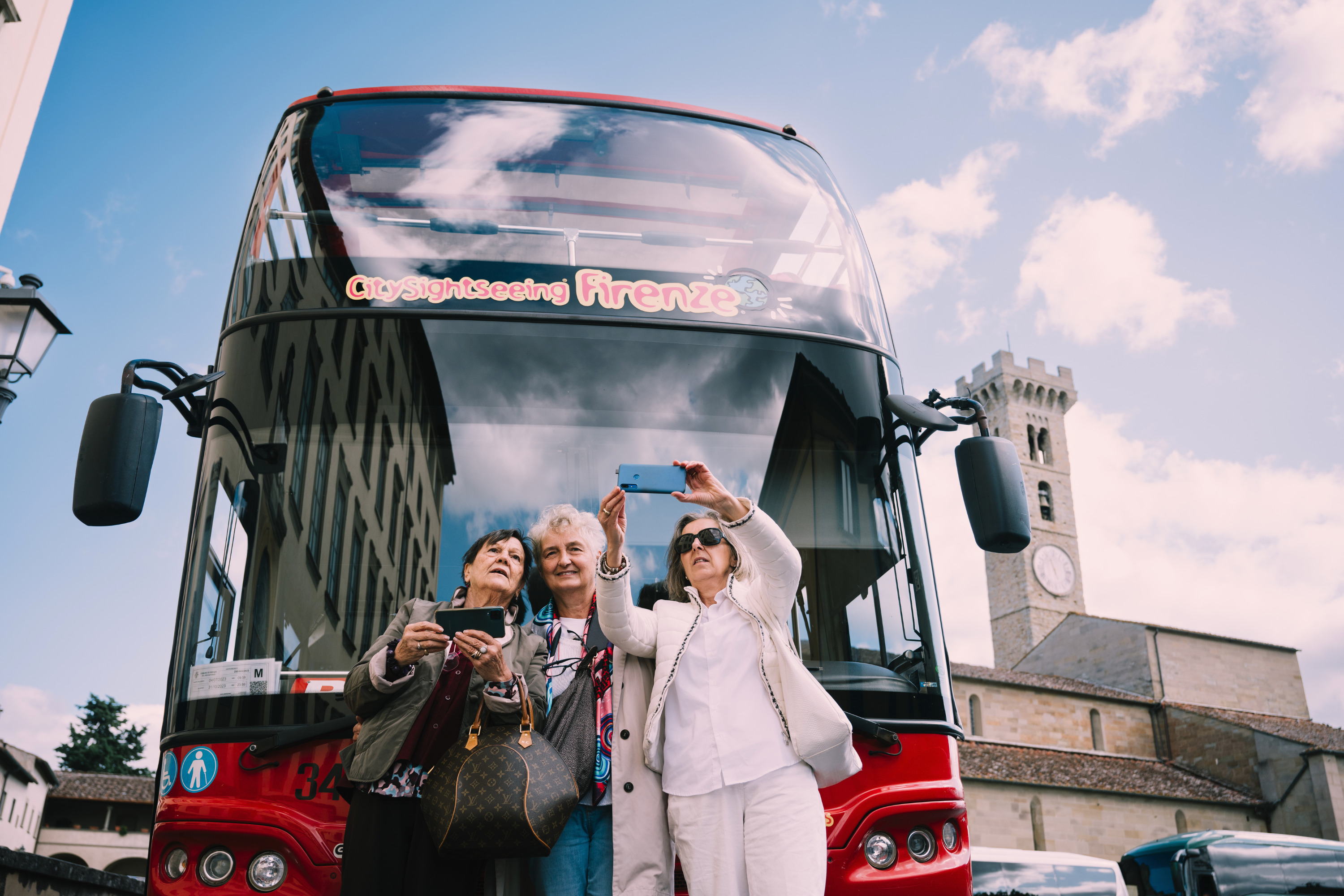 People standing in front of the bus