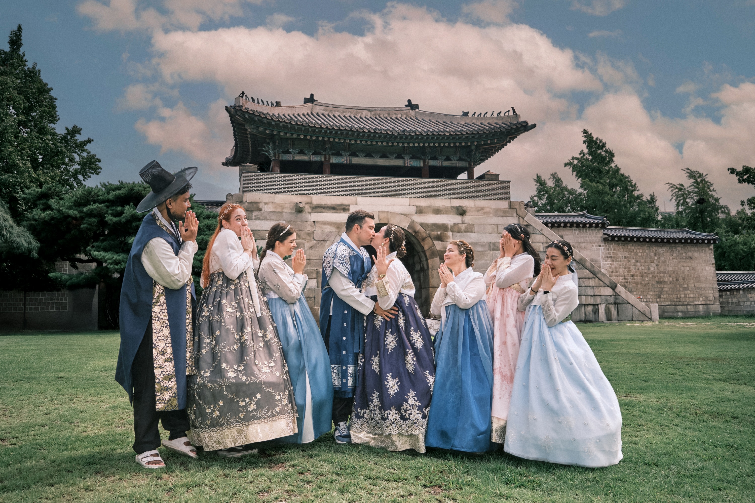 Visitors in colorful traditional hanbok dress at Gyeongbokgung Palace in Seoul