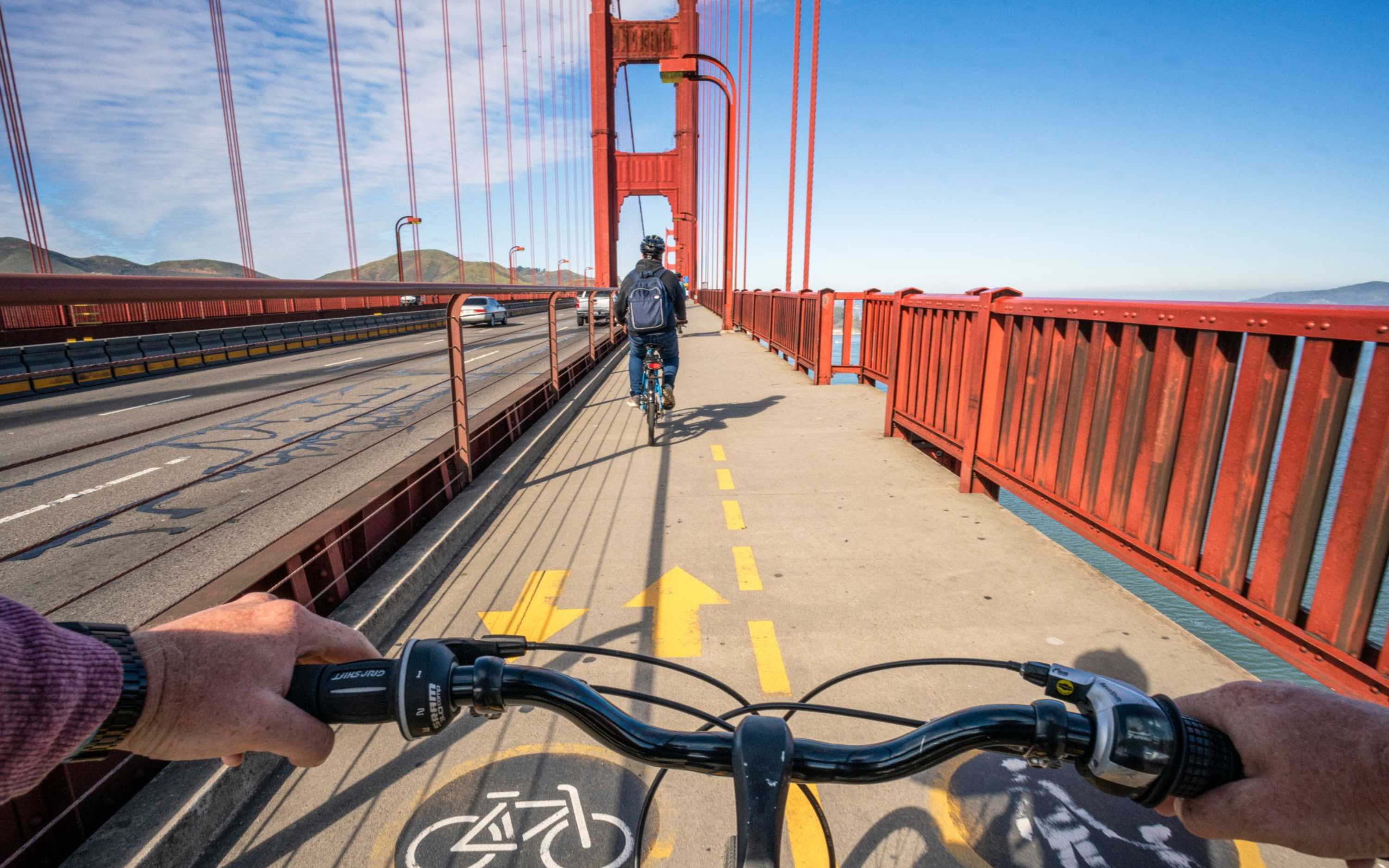 Cycling across the iconic Golden Gate Bridge offers unforgettable views of the bay