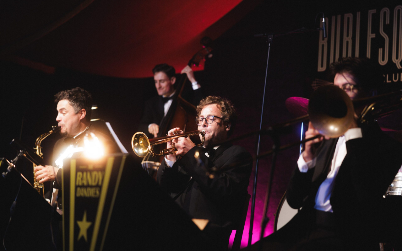 The jazz band sets the mood with smooth rhythms and timeless sophistication