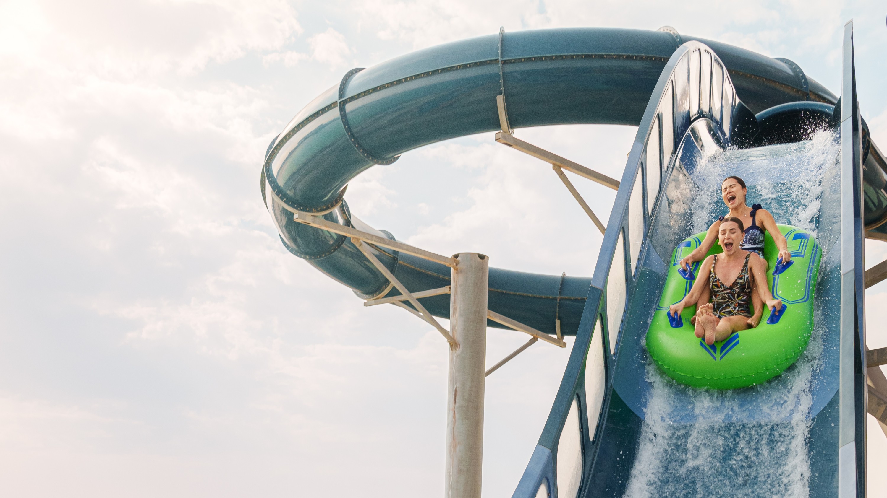 Screaming with excitement on a thrilling water slide adventure at Meryal Waterpark