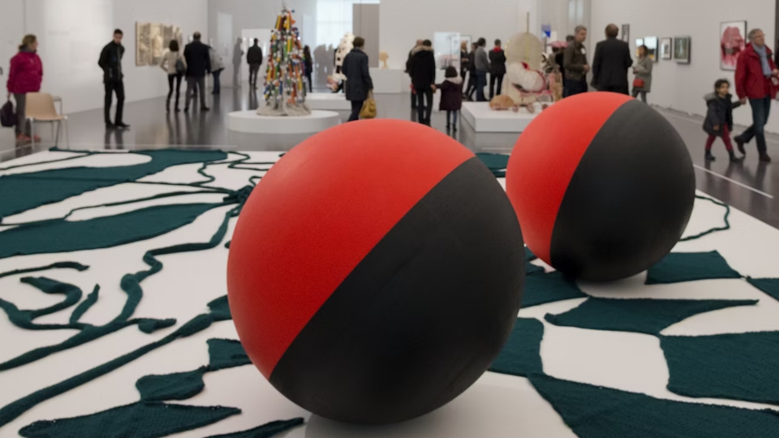 Exhibition space showcasing contemporary artworks within the museum's modern design