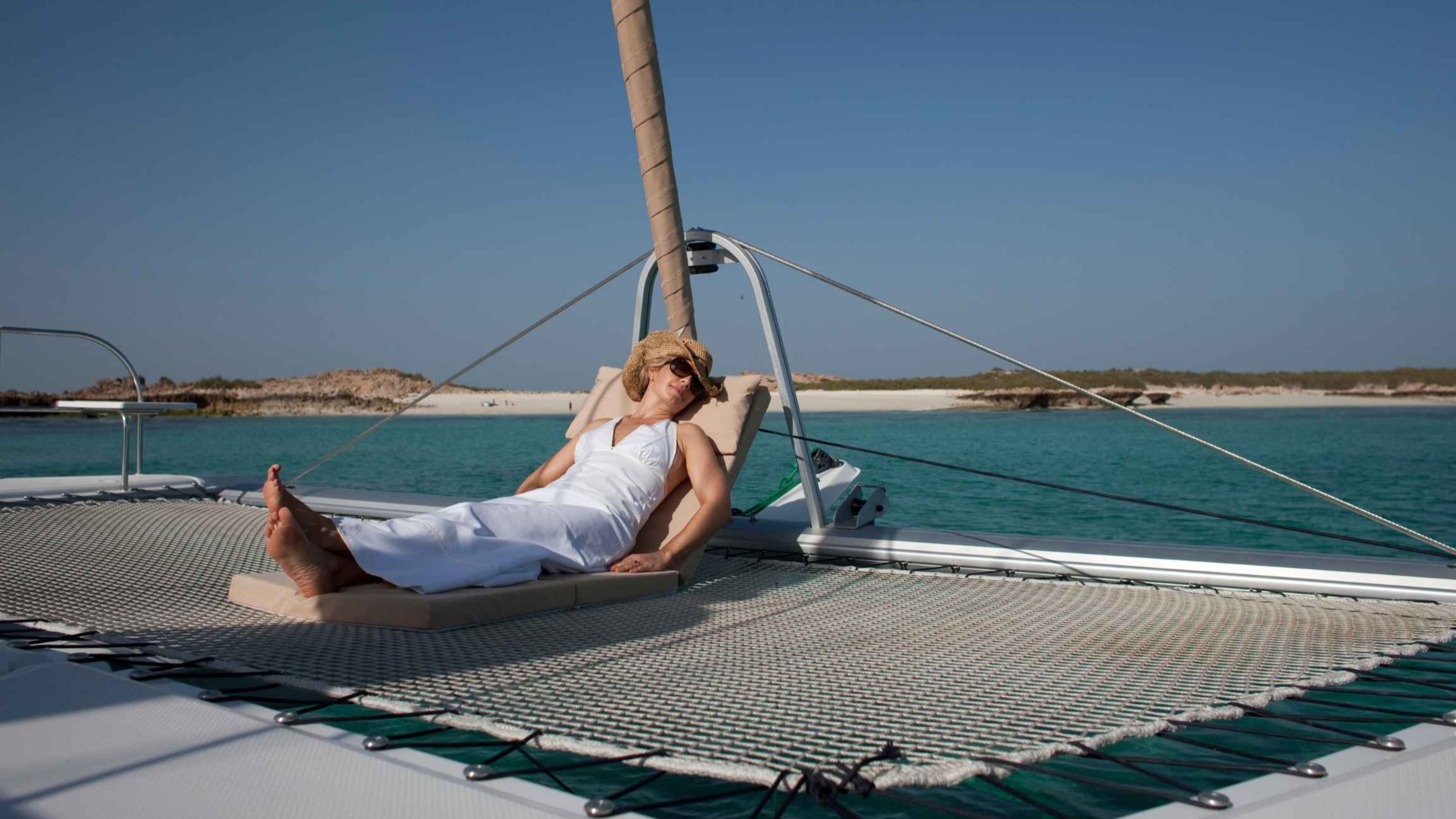 Spot graceful sea turtles gliding through the crystal-clear waters of the Daymaniyat Islands