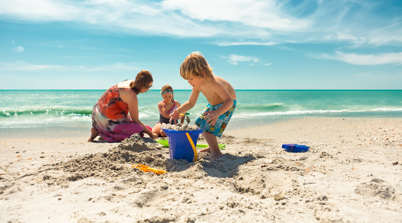 a family playing with sand at Clearwater Beach