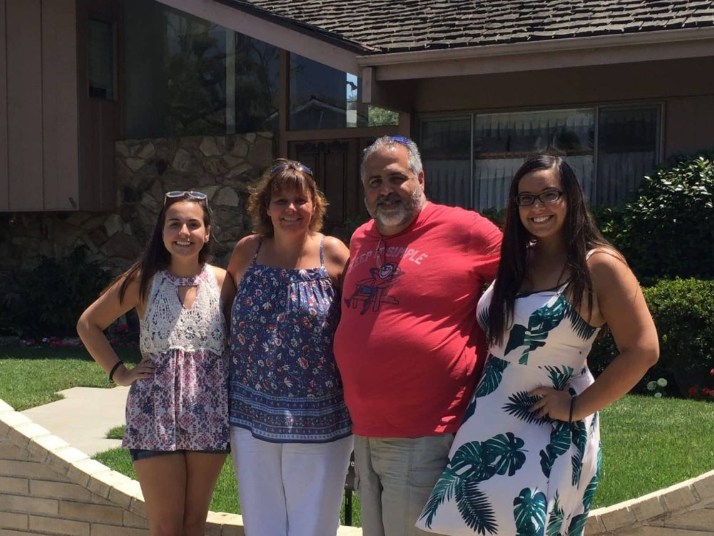 Excited guests snapping photos of a mansion once owned by a famous Hollywood actor