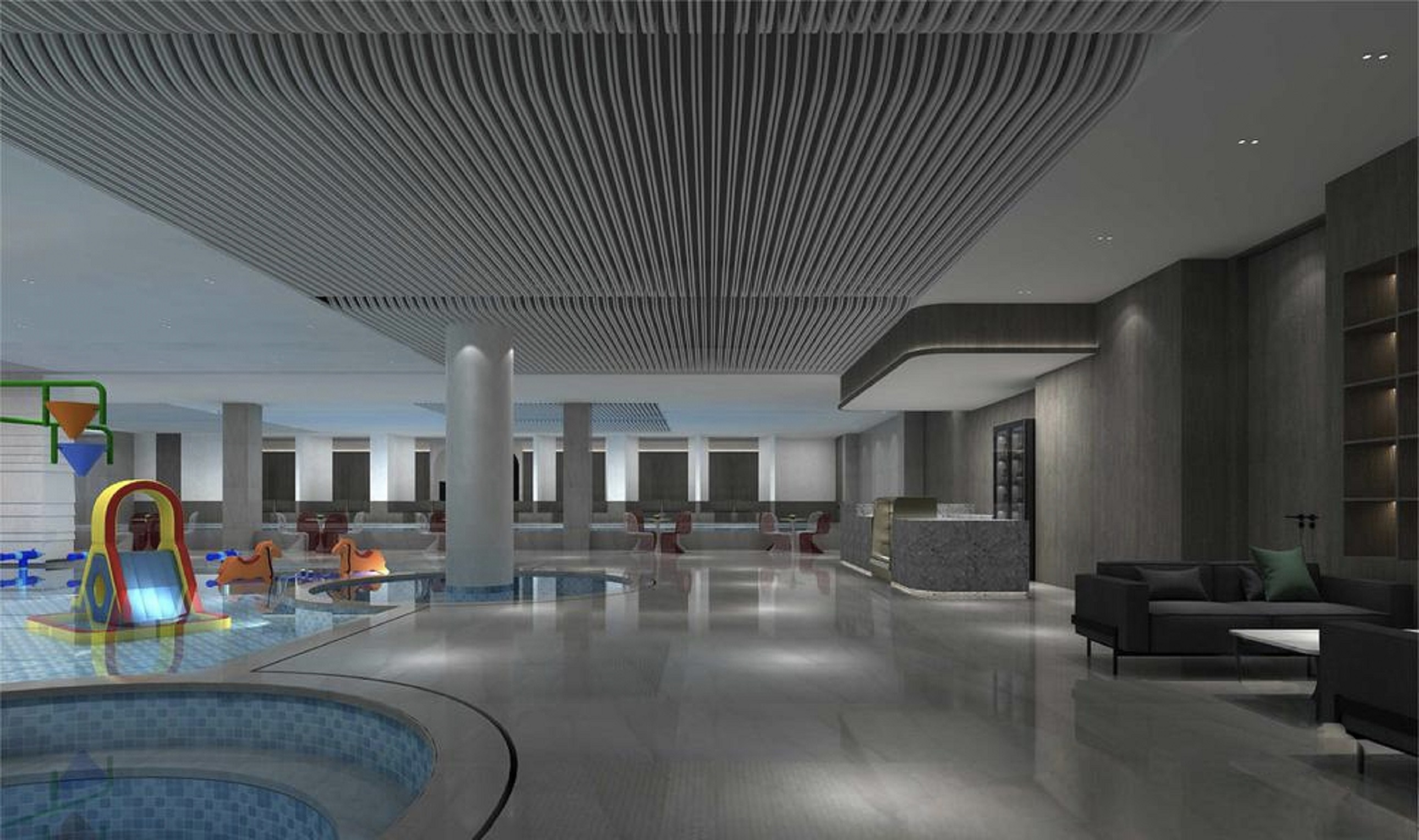 弧形的淺水池邊緣鋪著藍色瓷磚,池內有彩色的遊樂設施 弧形的淺水池邊緣鋪著藍色瓷磚,池內有彩色的遊樂設施