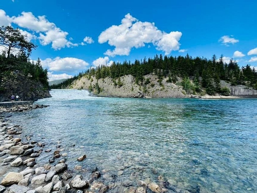 Sparkling turquoise waters of Lake Louise reflecting snow-capped Rocky Mountain peaks