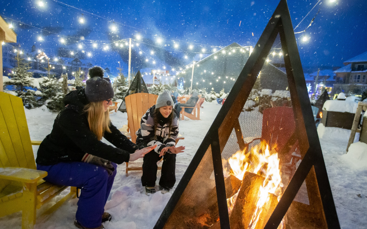 Cozy cafes and boutique shops line the village streets, perfect for warming up between runs