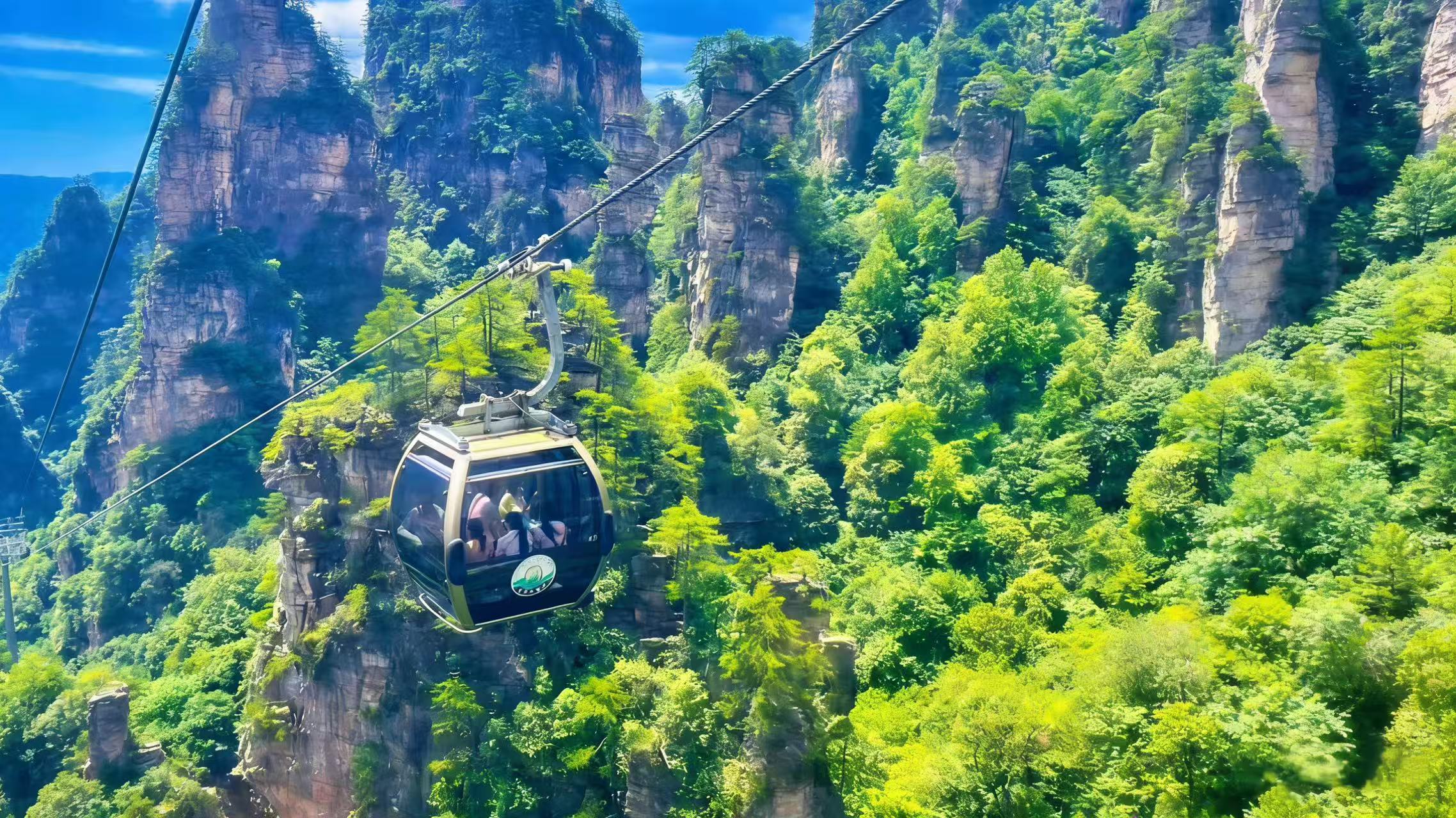 After lunch, take the cool Tianzi Mountain Cable Car down with groups of rockery hills passing by outside your glass window. After the tour you will be transferred back to your hotel