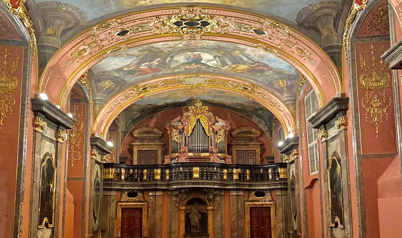 Elegant Baroque Mirror Chapel with ornate mirrors, gold accents, and rich historical architecture