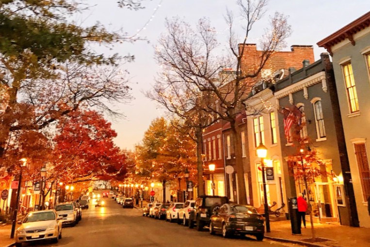 Wander through Old Town Alexandria’s vibrant streets, enjoying the warm orange hues