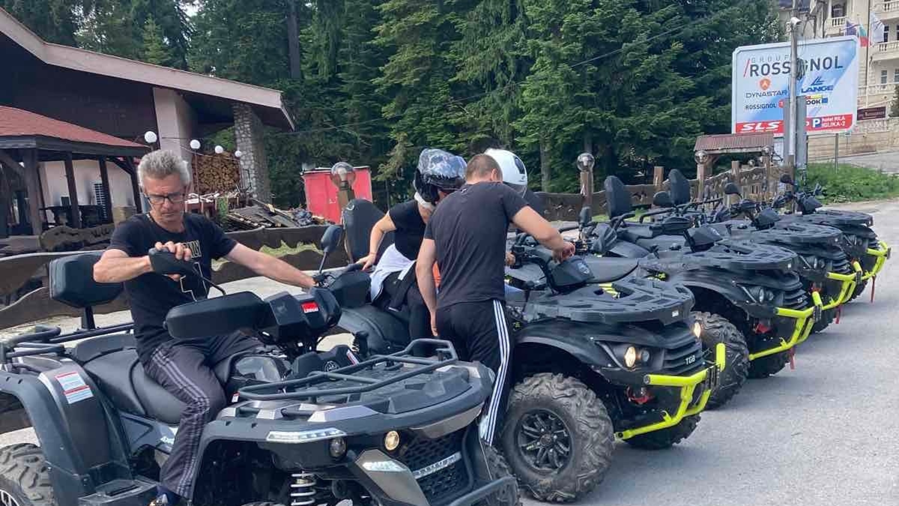 Quad bikes lined up as excited guests test them out before the adventure begins