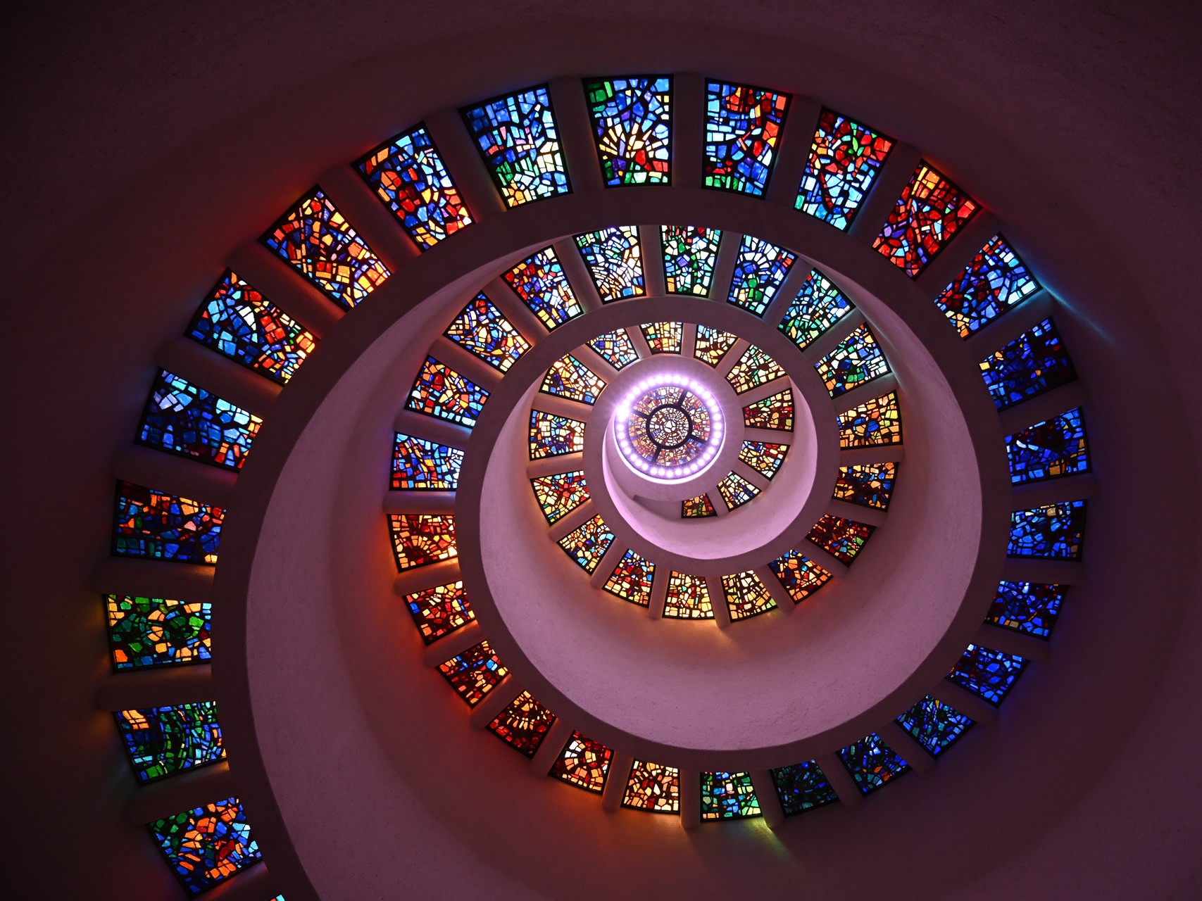 Glory Window in the Chapel of Thanksgiving symbolizes the blessing of the Divine descending to earth