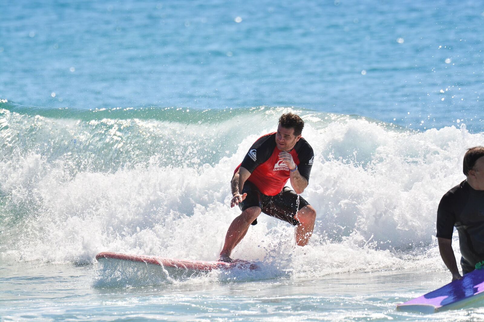 Ride the perfect wave during an exciting surfing lesson on Cerritos Beach