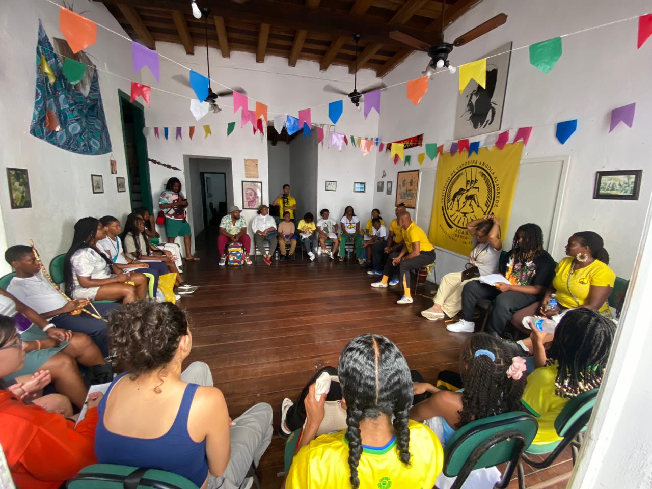 students listeting the history of capoeira 